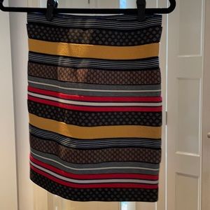 Skirt made out of ties in multicolor. Size 3.
